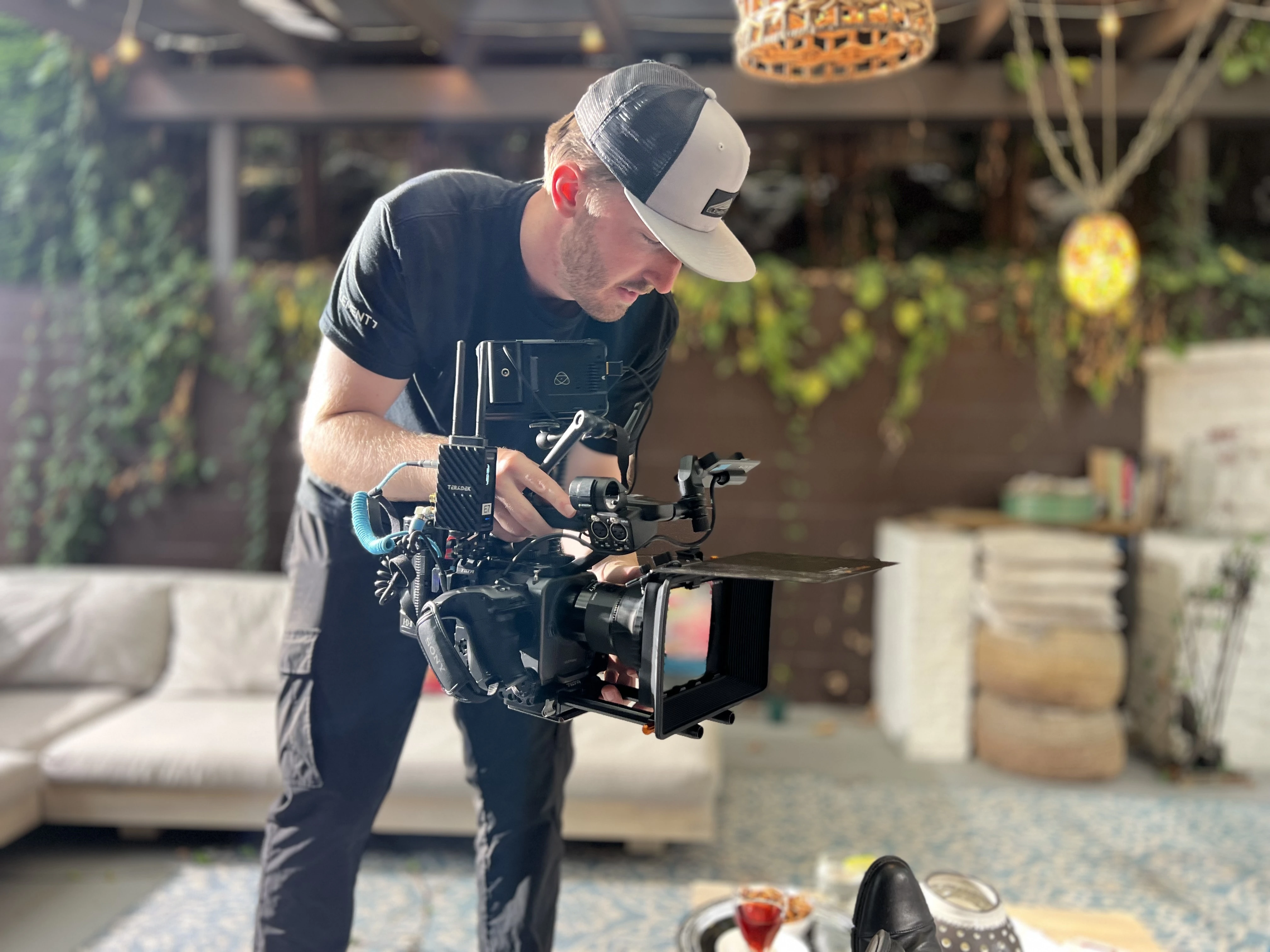 Element 7 camera operator filming at an outdoor patio location