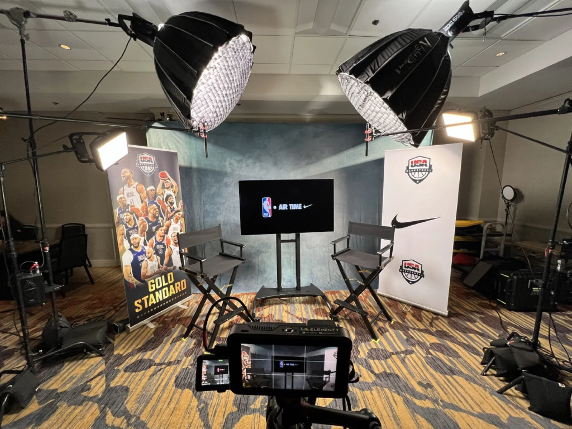 On-site interview set with lighting and branded backdrop