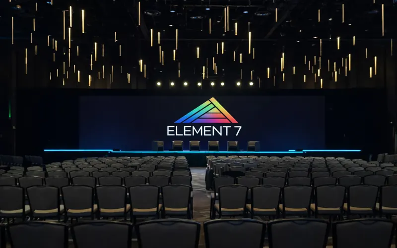 Conference stage with Element 7 branding and empty seats