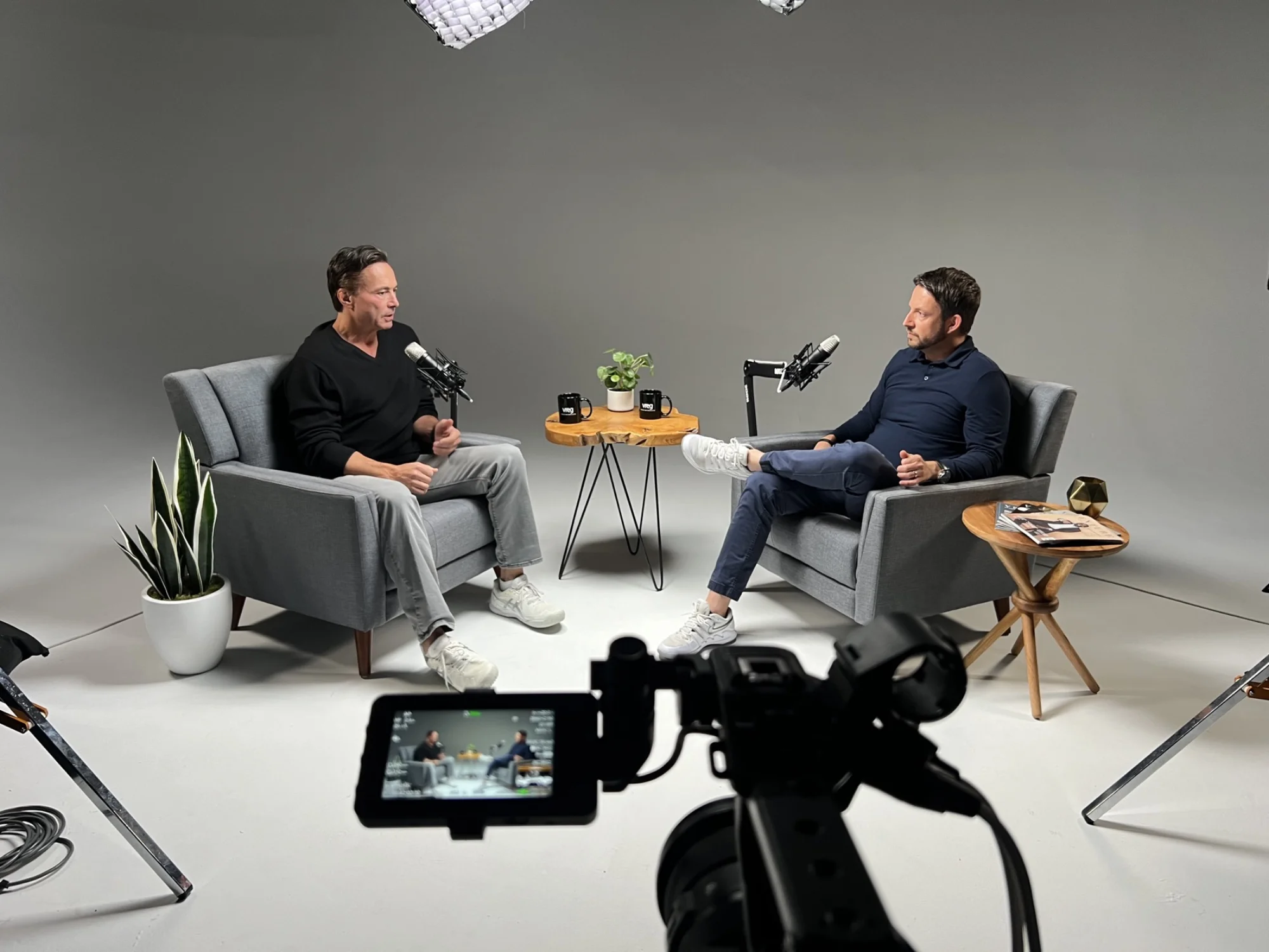 Podcast interview setup in white cyc studio