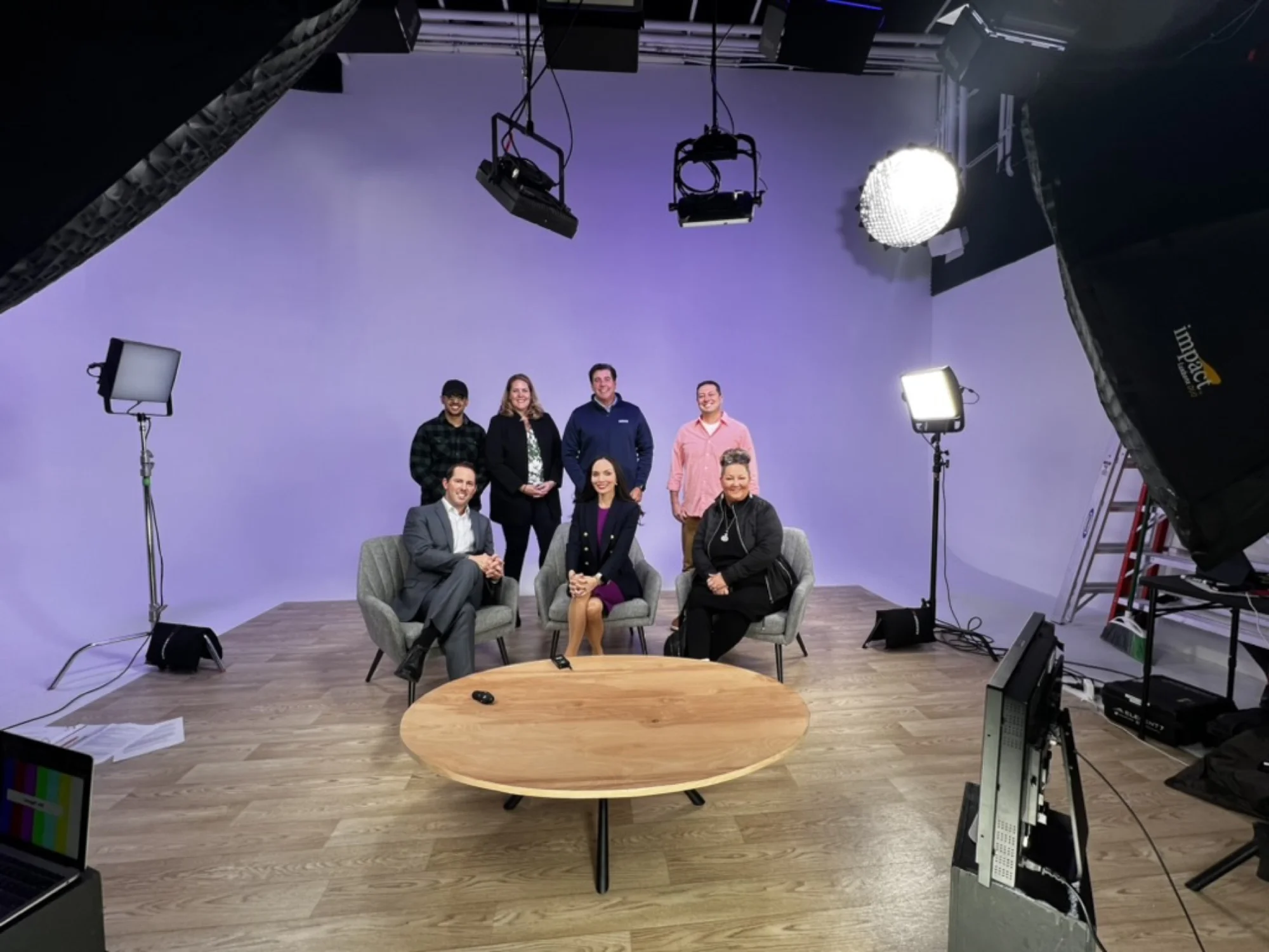 Panel discussion set in studio with seated speakers